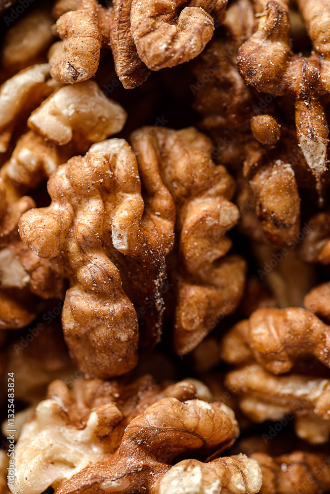 organic raw walnuts in a wooden bowl organic raw walnuts in a wooden bowl