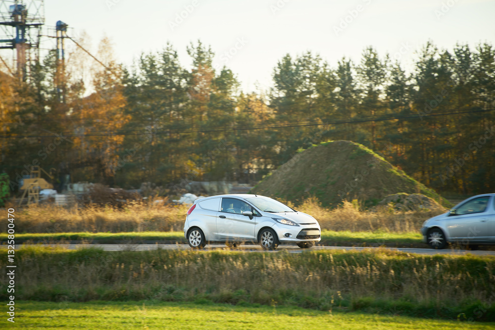 Fototapeta premium Modern white car on rural roadside