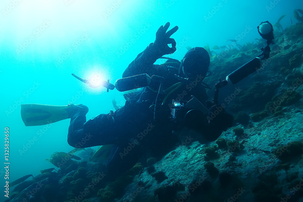 Fototapeta premium underwater photographer with a camera, diver hobby special underwater boxing with a camera