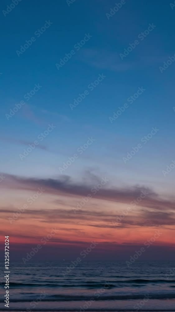 Sky transform from the first light of dawn to a radiant sunrise, with beautiful clouds painting the morning horizon at a beach in the ocean. Sky transform from the first light of dawn to a radiant sunrise, with beautiful clouds painting the morning horizon at a beach in the ocean.