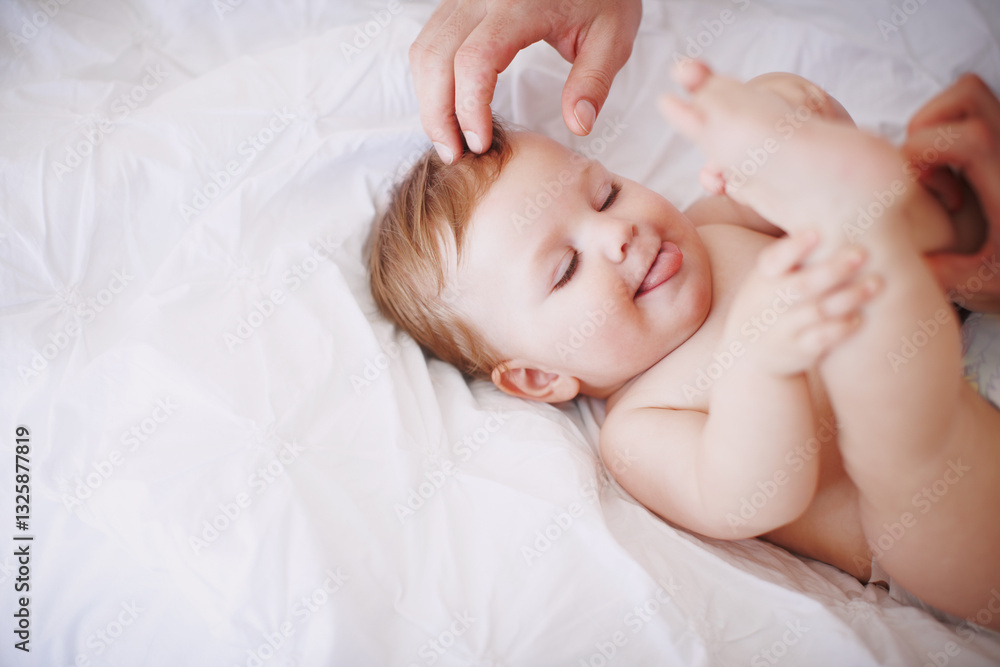 Hands, parent and baby with playing on bed for child development, learning motor skills or curious. Above, space or playful infant in home with relax, morning routine or security with support or care Hands, parent and baby with playing on bed for child development, learning motor skills or curious. Above, space or playful infant in home with relax, morning routine or security with support or care