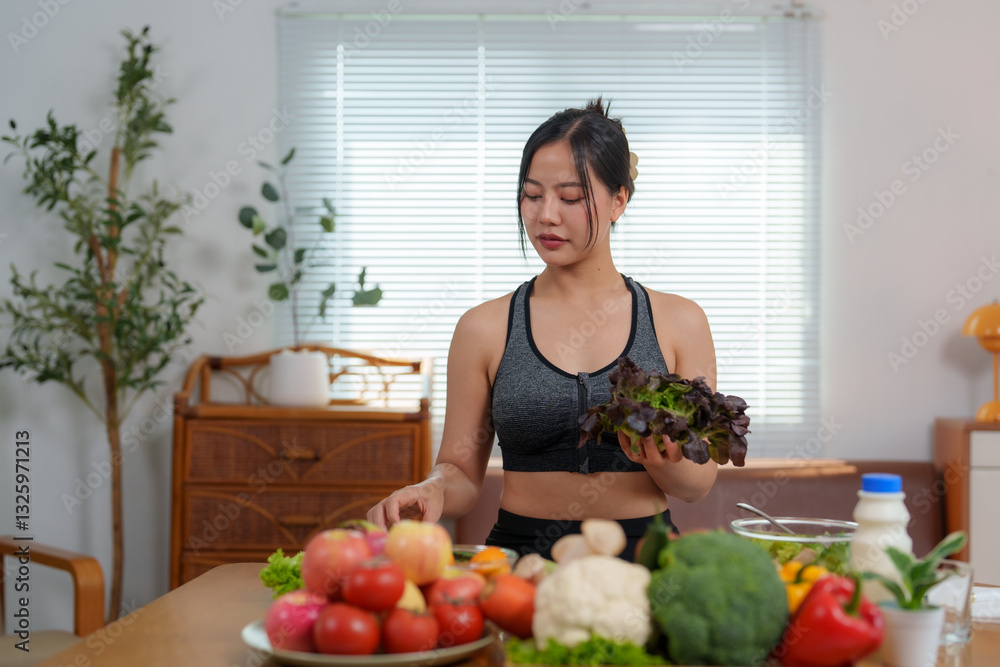 Young asian woman preparing healthy meal with fresh vegetables Young asian woman preparing healthy meal with fresh vegetables