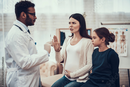 Photography Indian doctor seeing patients in office