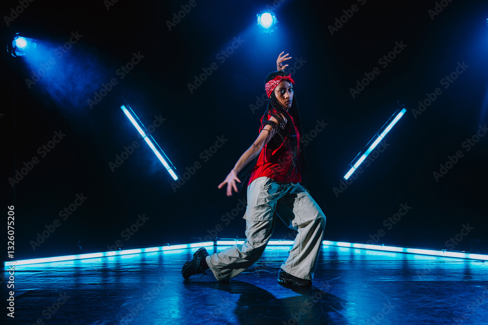 Fototapeta premium Hip hop dancer dancing in a cool studio with neon lights.