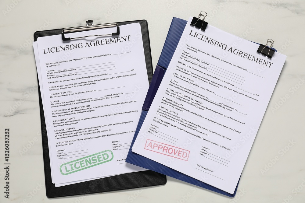 Obraz premium Licensing agreement documents on white marble table, flat lay