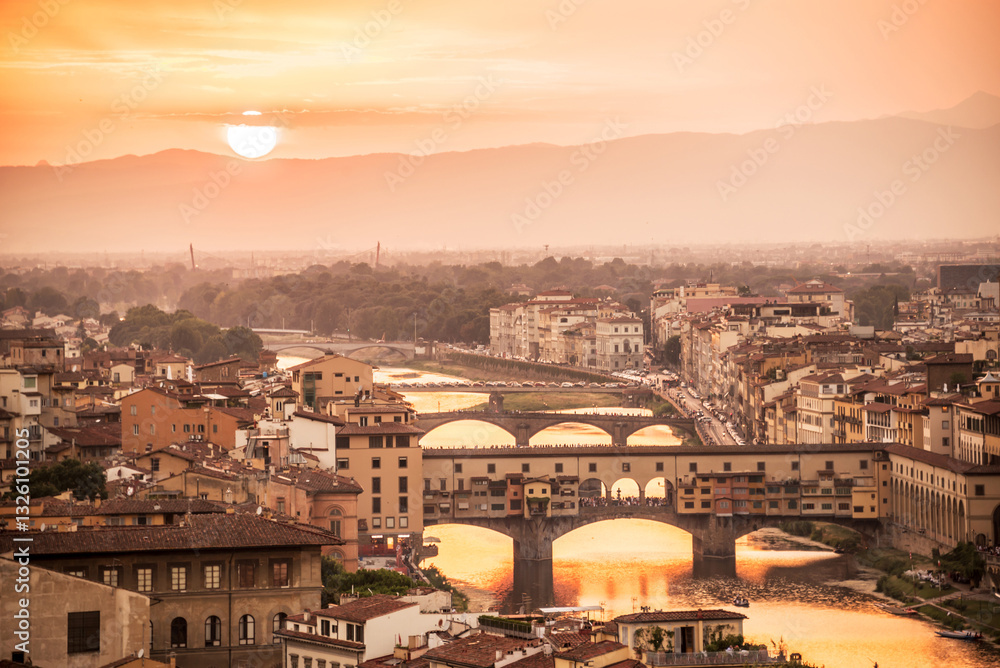 Aerial view of Florence at sunset with the Ponte Vecchio and the Arno river, Tuscany, Italy