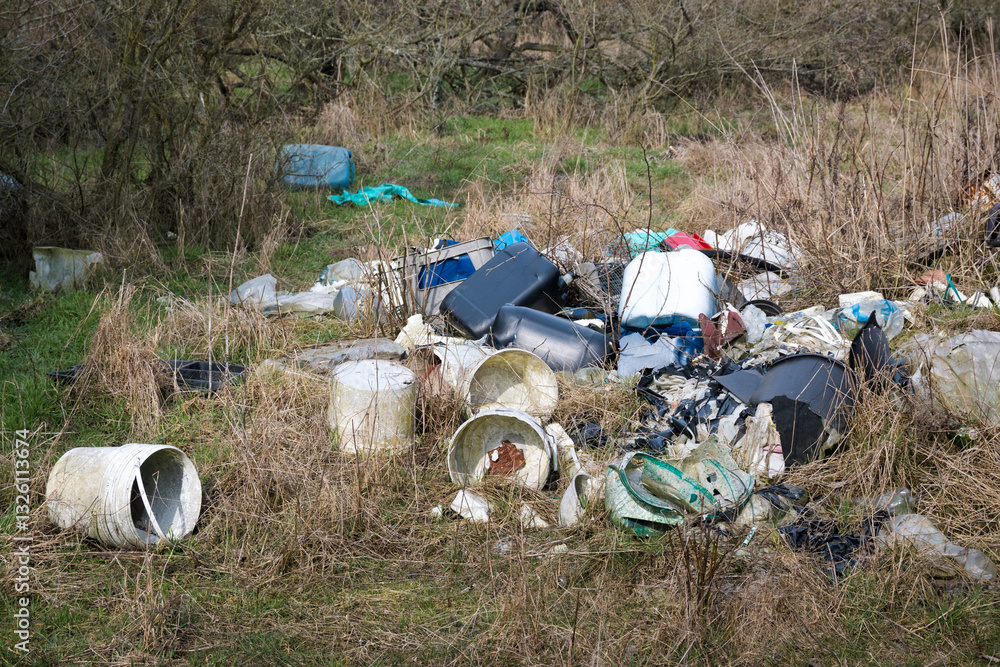 Illegal waste dump in the forest. Ecological disaster. Human stupidity, pollution of our own environment, the planet.
