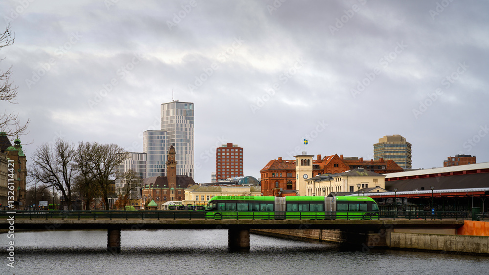 A double articulated electric bus leaving Malmo Central Station in Malmo, Sweden. A double articulated electric bus leaving Malmo Central Station in Malmo, Sweden.