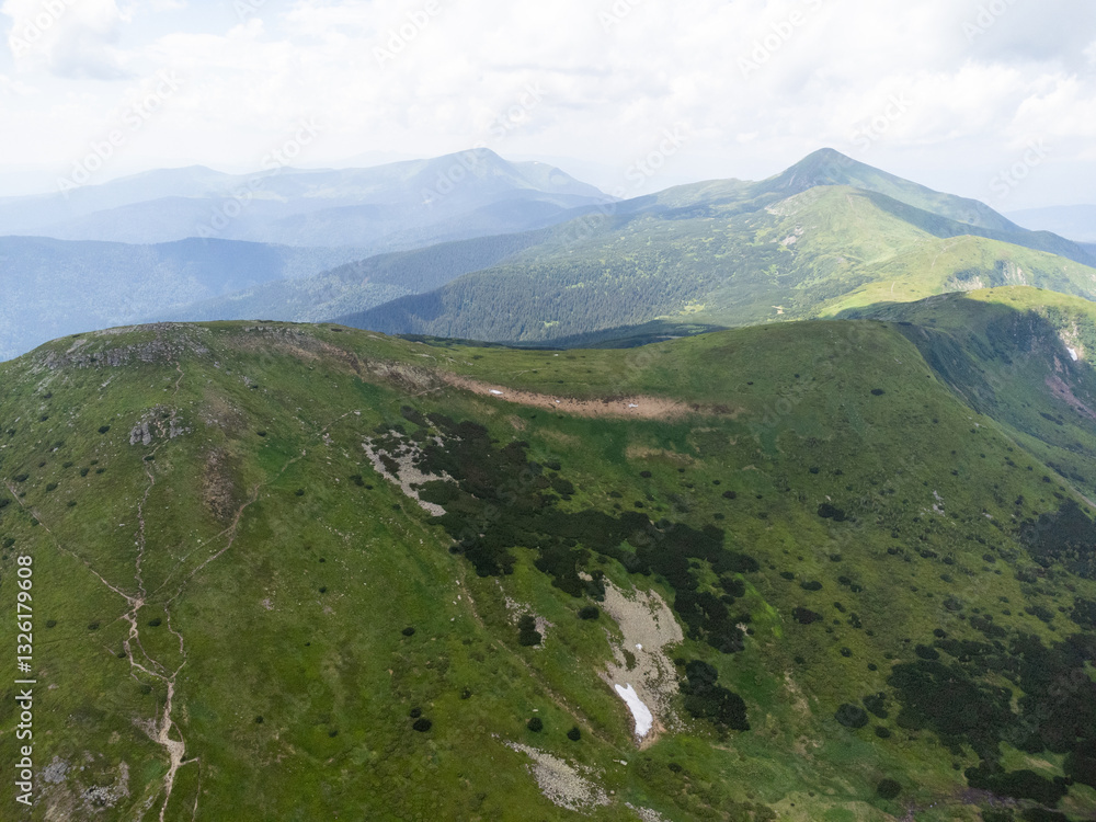 Obraz premium Aerial view of Nesamovyte Lake, a glacial alpine lake in the Carpathians, Ukraine