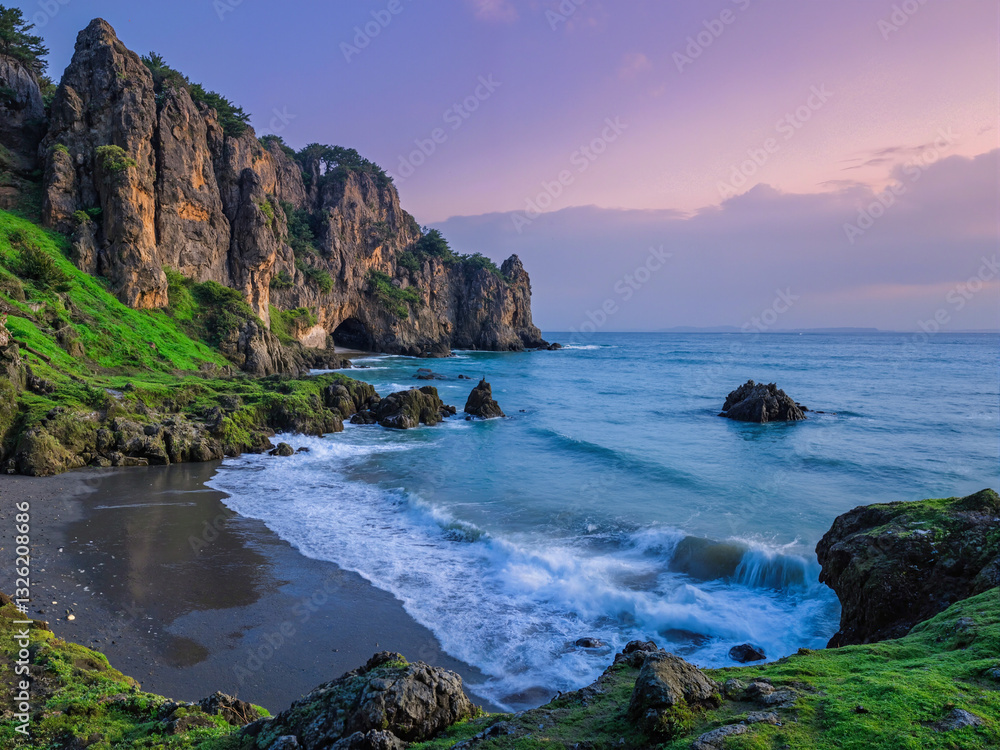 seascape at sunset with dramatic rock