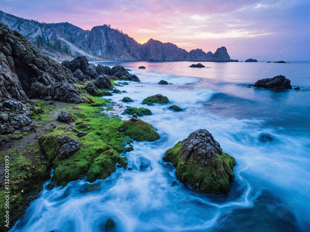 seascape at sunset with dramatic rock