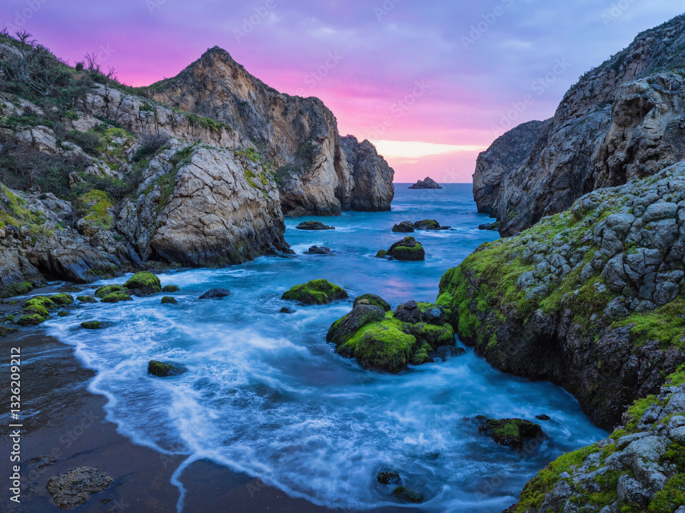 seascape at sunset with dramatic rock