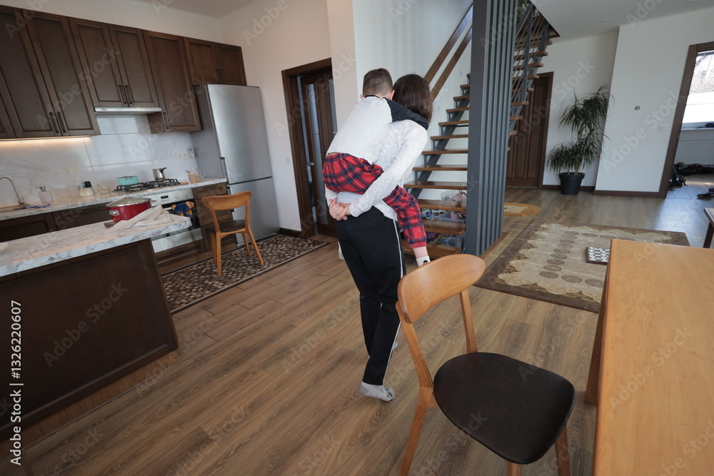 Mother and a boy spending time together playing indoors Mother and a boy spending time together playing indoors
