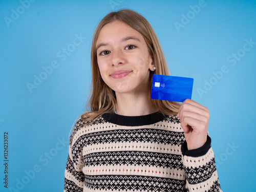 Close up photo of optimistic beautiful caucasian girl wearing striped sweater hold card