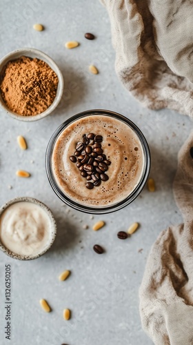 Creamy Coffee Drink Garnished With Roasted Beans on a Textured Background