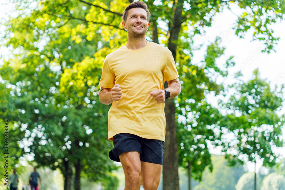 Jogging through a vibrant park in sunny weather with trees and greenery in the background Jogging through a vibrant park in sunny weather with trees and greenery in the background