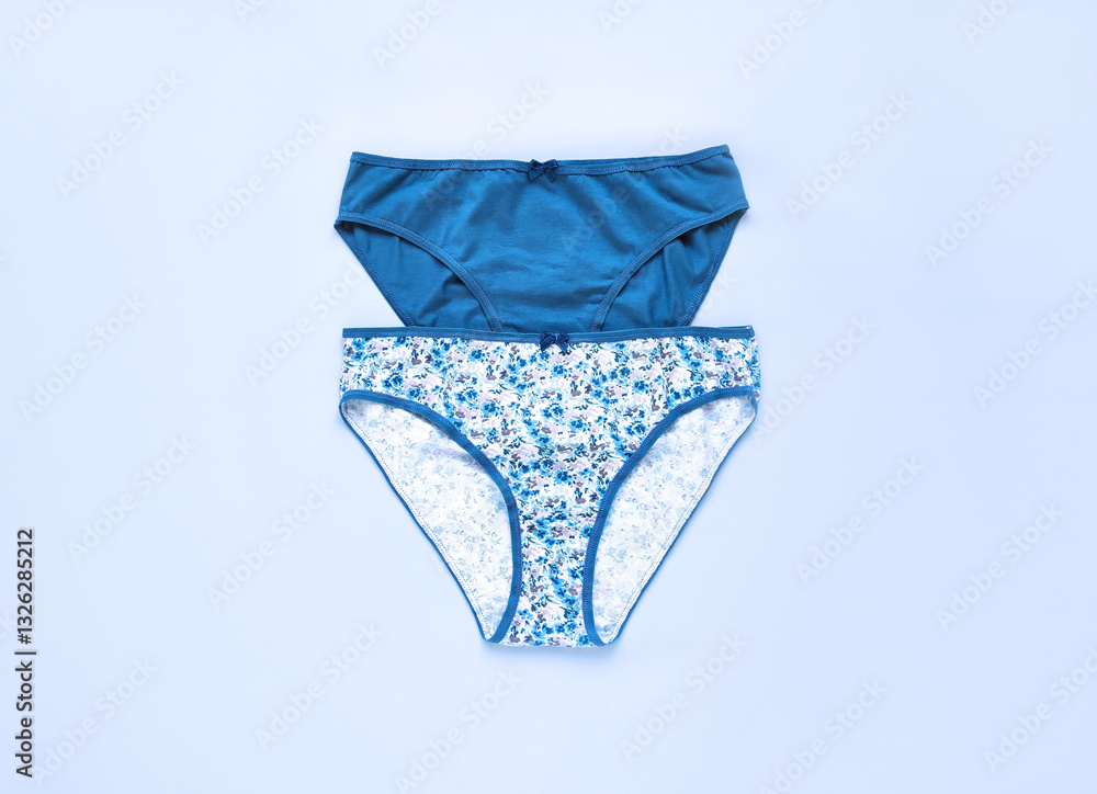 Classic women's underwear, cotton slip panties on a blue background Classic women's underwear, cotton slip panties on a blue background