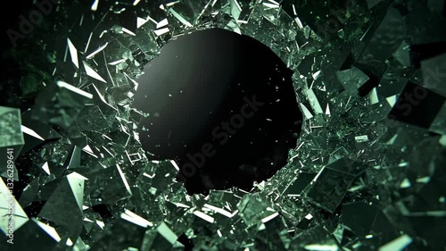 Green glass breaking dynamically, shattering into sharp transparent fragments with high energy motion against dark surface, creating clean visual effect compositing opportunity