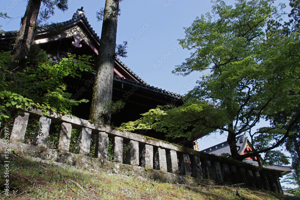 stone palisade and pavilion in a temple in nikko in japan