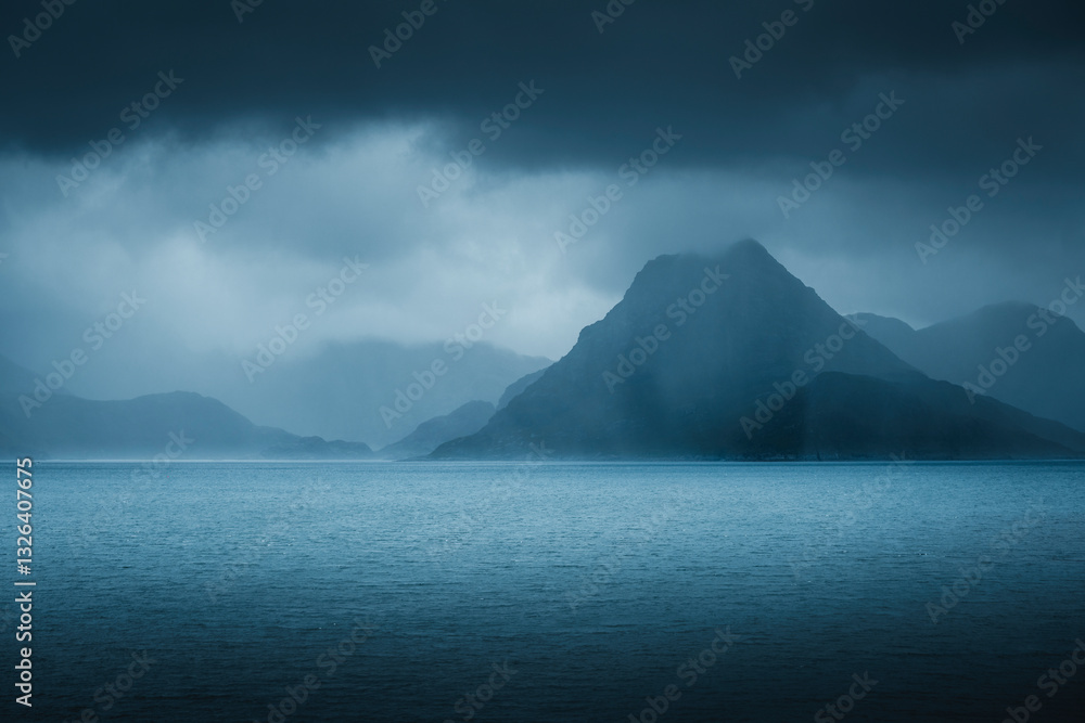 Aerial view of serene highlands with rugged mountains and tranquil water under an overcast sky, Isle of Skye, Scotland, United Kingdom. Aerial view of serene highlands with rugged mountains and tranquil water under an overcast sky, Isle of Skye, Scotland, United Kingdom.