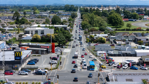 Aerial view of busy cityscape with modern buildings, roads, and greenery, Richmond, Tasman, New Zealand.