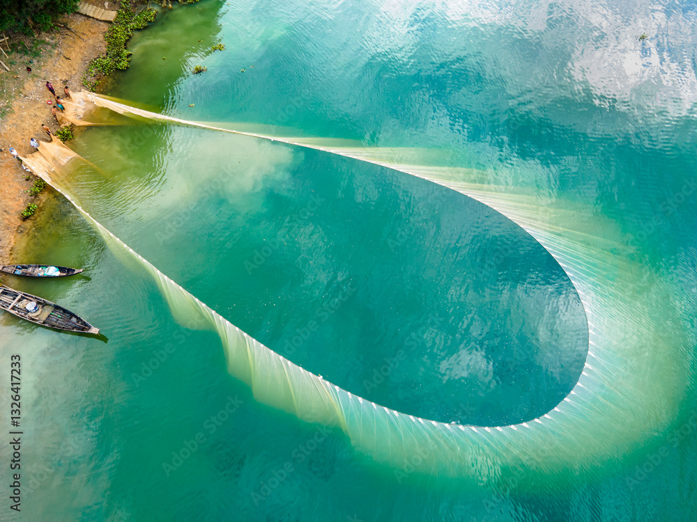 Aerial view of colorful fishing boats and nets on tranquil Kaptai Lake surrounded by vibrant greenery, Rangamati, Chittagong, Bangladesh. Aerial view of colorful fishing boats and nets on tranquil Kaptai Lake surrounded by vibrant greenery, Rangamati, Chittagong, Bangladesh.