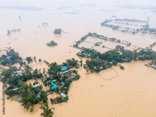 Aerial view of flooded village with submerged houses and greenery, Jhenaigati, Sherpur, Bangladesh. photo