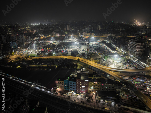 Wallpaper Mural Aerial view of a bustling urban cityscape with modern buildings and bright city lights at night, Gendaria, Dhaka, Bangladesh. Torontodigital.ca