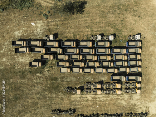 Aerial view of parked trucks in an organized fleet on a large scale logistics center, Suti Para Union, Dhamrai, Dhaka, Bangladesh. photo