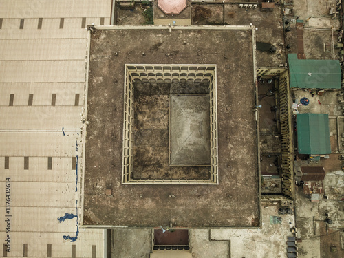 Aerial view of baitul mukarram national mosque with geometric patterns and urban landscape, Dhaka, Dhaka, Bangladesh. photo