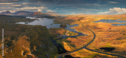 Aerial view of tranquil derryclaire lough surrounded by serene mountains and picturesque countryside, Glencoaghan, County Galway, Ireland.