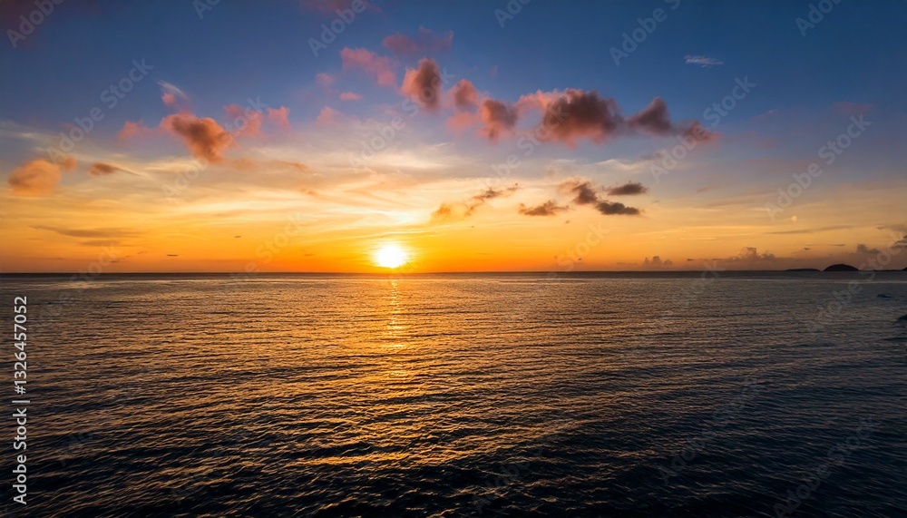 Obraz premium tranquil sunset over the ocean, with the sky painted in warm 