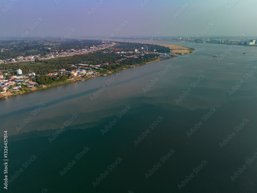 Aerial view of serene mekong and tonle sap rivers with urban landscape and buildings, Chroy Changvar Section, Phnom Penh, Cambodia. Aerial view of serene mekong and tonle sap rivers with urban landscape and buildings, Chroy Changvar Section, Phnom Penh, Cambodia.