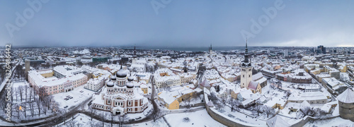 Aerial view of the historic old town with St Olaf Church in a snowy winter landscape, Tallinn, Harju, Estonia.
