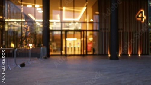 Wallpaper Mural Blurred night street view of a london building entrance with winter decorations and defocused lights in the united kingdom during autumn. Torontodigital.ca