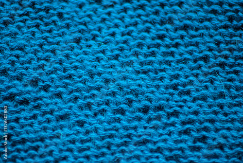 Knitting on a knitting needle. Background from a knitted pattern.