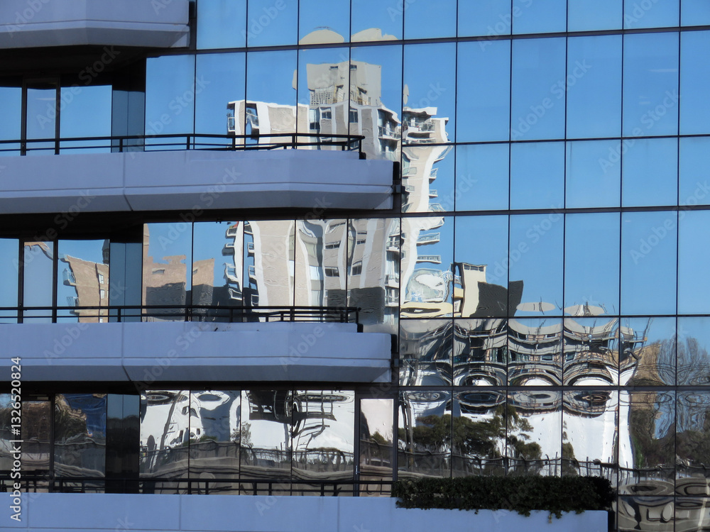Building reflection on glass with blue sky Building reflection on glass with blue sky