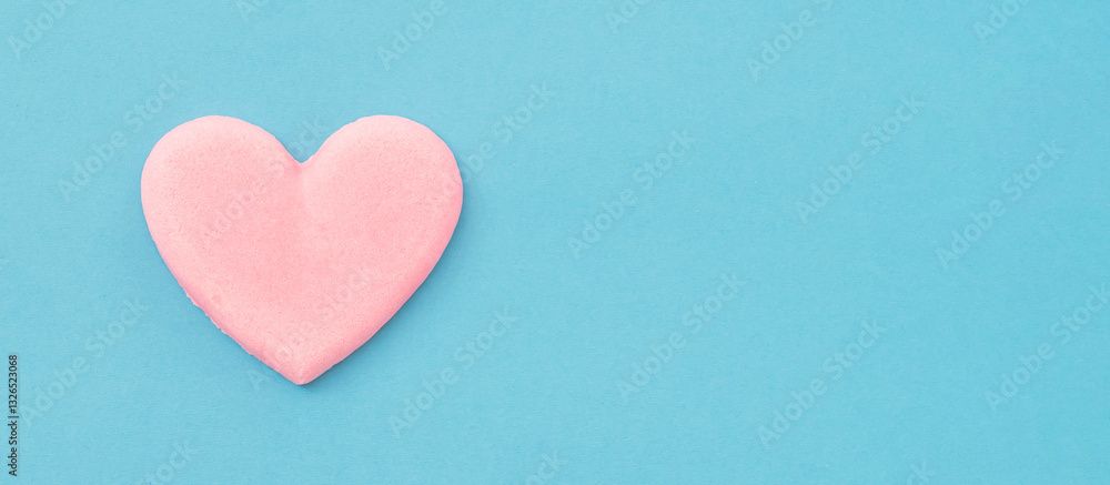 Fototapeta premium Hearts on a light blue background. 水色背景上のハート。ハートはお菓子。