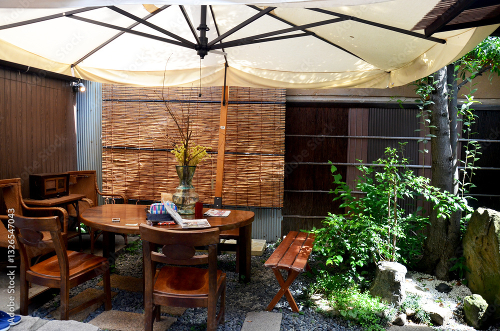 Naklejka premium Decorative modern Wooden Furniture and umbella in the garden