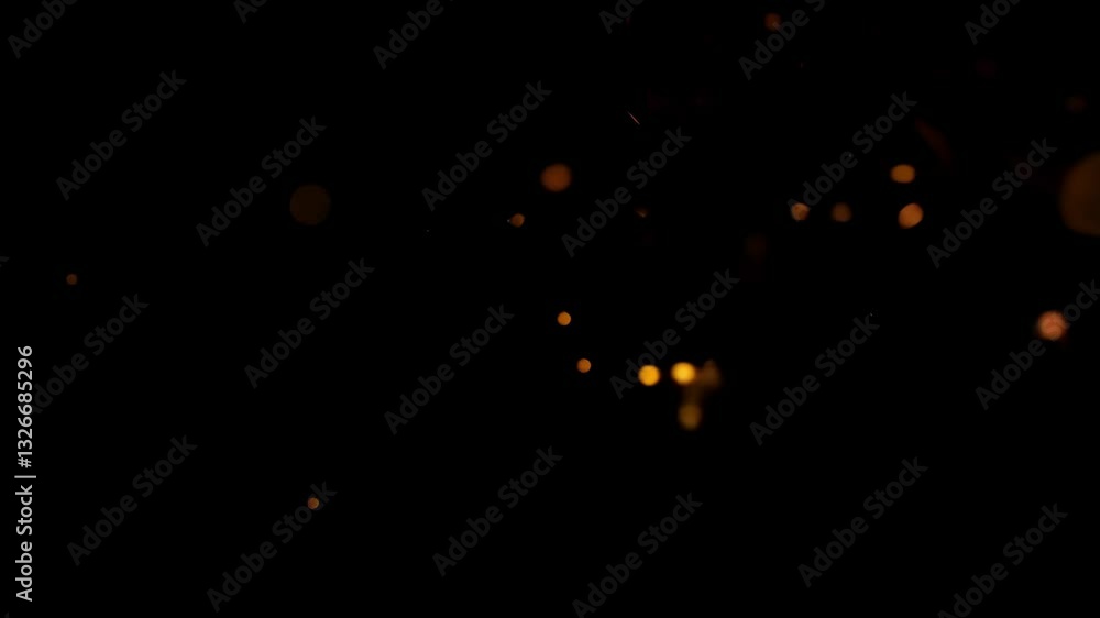 Bright ember sparks flicker in the darkness, adding warmth and dynamic ...