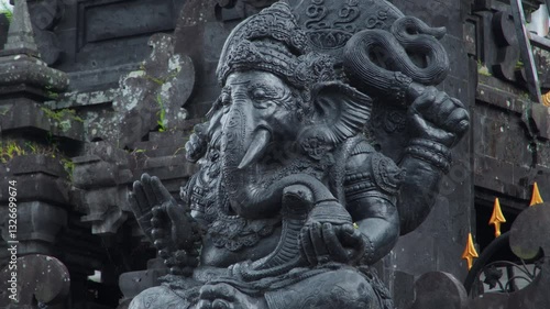 Wallpaper Mural An old stone statue of Ganesha covered with moss. Torontodigital.ca