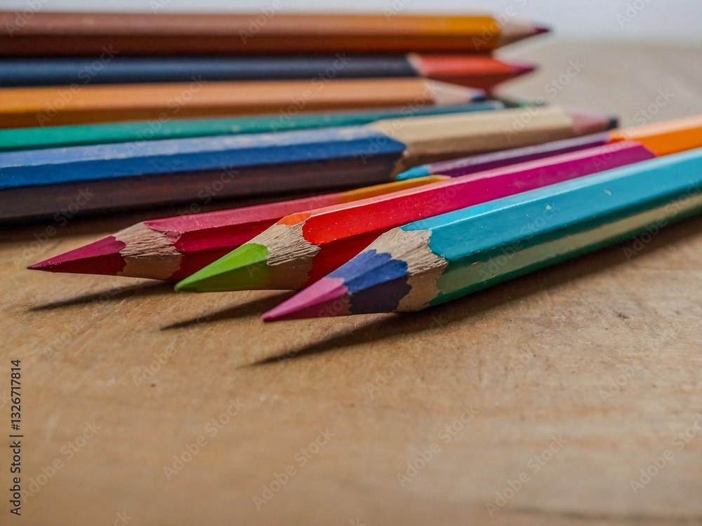 Fototapeta premium Colorful pencils in an art studio bathed in natural light.