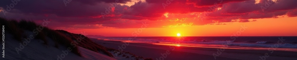Fototapeta premium Dramatic sunset over Glenelg Beach; silhouetted dunes against fiery sky , shadow, red