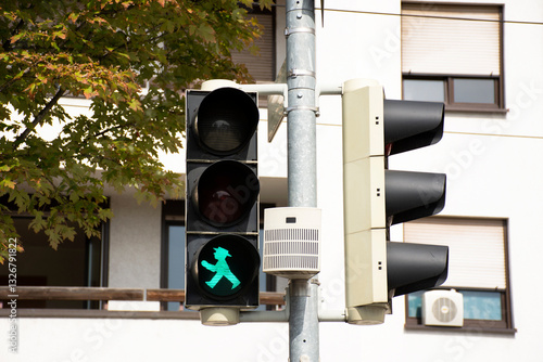 Green traffic lights signals on Sandhausen street at Heidelberg-Kirchheim village in Heidelberg, Germany