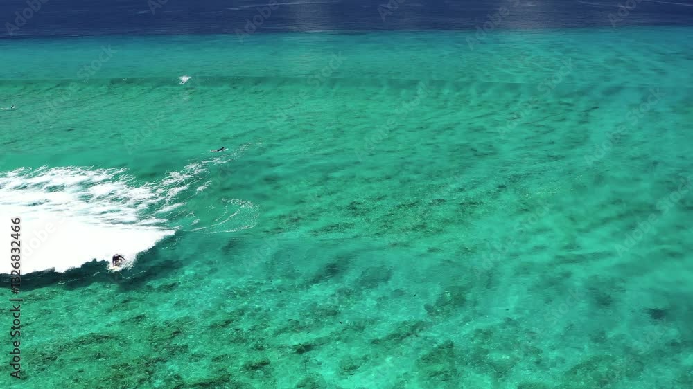 Aerial view of beautiful desert island surf with turquoise water and ocean waves, Eydhafushi, Baa Atoll, Maldives. Aerial view of beautiful desert island surf with turquoise water and ocean waves, Eydhafushi, Baa Atoll, Maldives.