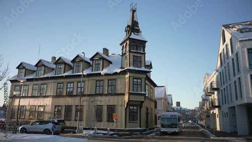 View of snow covered buildings and restaurants on Laekjargata in winter, Reykjavik, Iceland