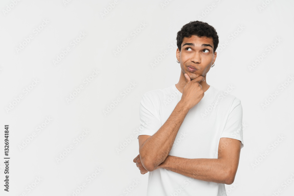 Thoughtful african guy thinking try solve problem pose isolated on white studio background worried black man in glasses feels concerned puzzled lost in thoughts pondering making decision concept image Thoughtful african guy thinking try solve problem pose isolated on white studio background worried black man in glasses feels concerned puzzled lost in thoughts pondering making decision concept image