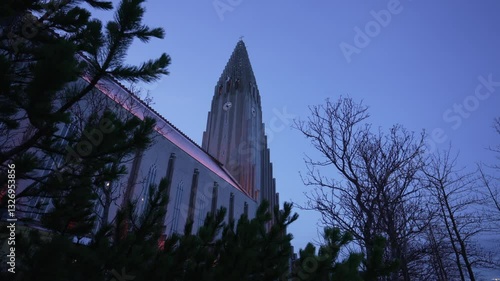 View of Hallgrimskirkja Church illuminated at dusk in winter, Reykjavik, Capital Region, Iceland