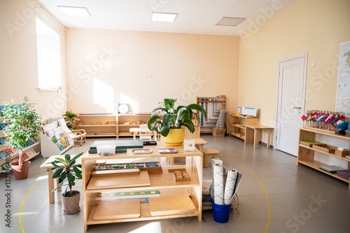 Montessori material. Wooden shelf with materials for Montessori studies