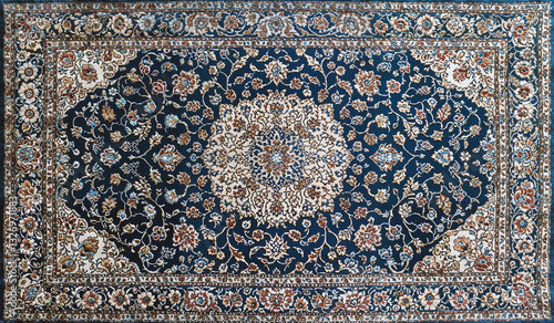 Traditional oriental rug with intricate floral pattern and elegant blue beige and brown decorative elements
